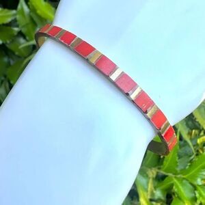 Red and gold tone brass bangle bracelet
